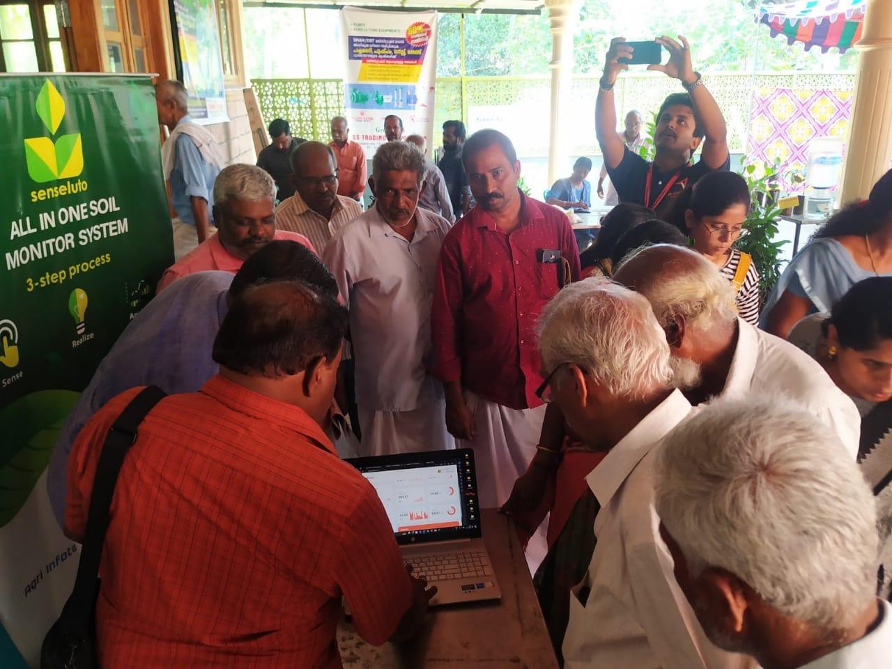 demonstration of our soil testing equipment in Seneluto, explaining agricultural scientist to farmers